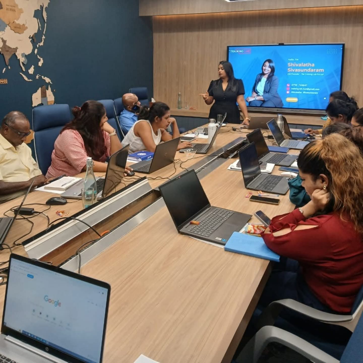 Shivalatha leading a corporate boardroom conversation