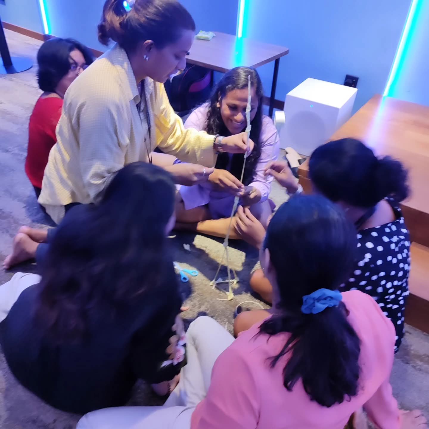 Participants taking part in an experiential team learning activity