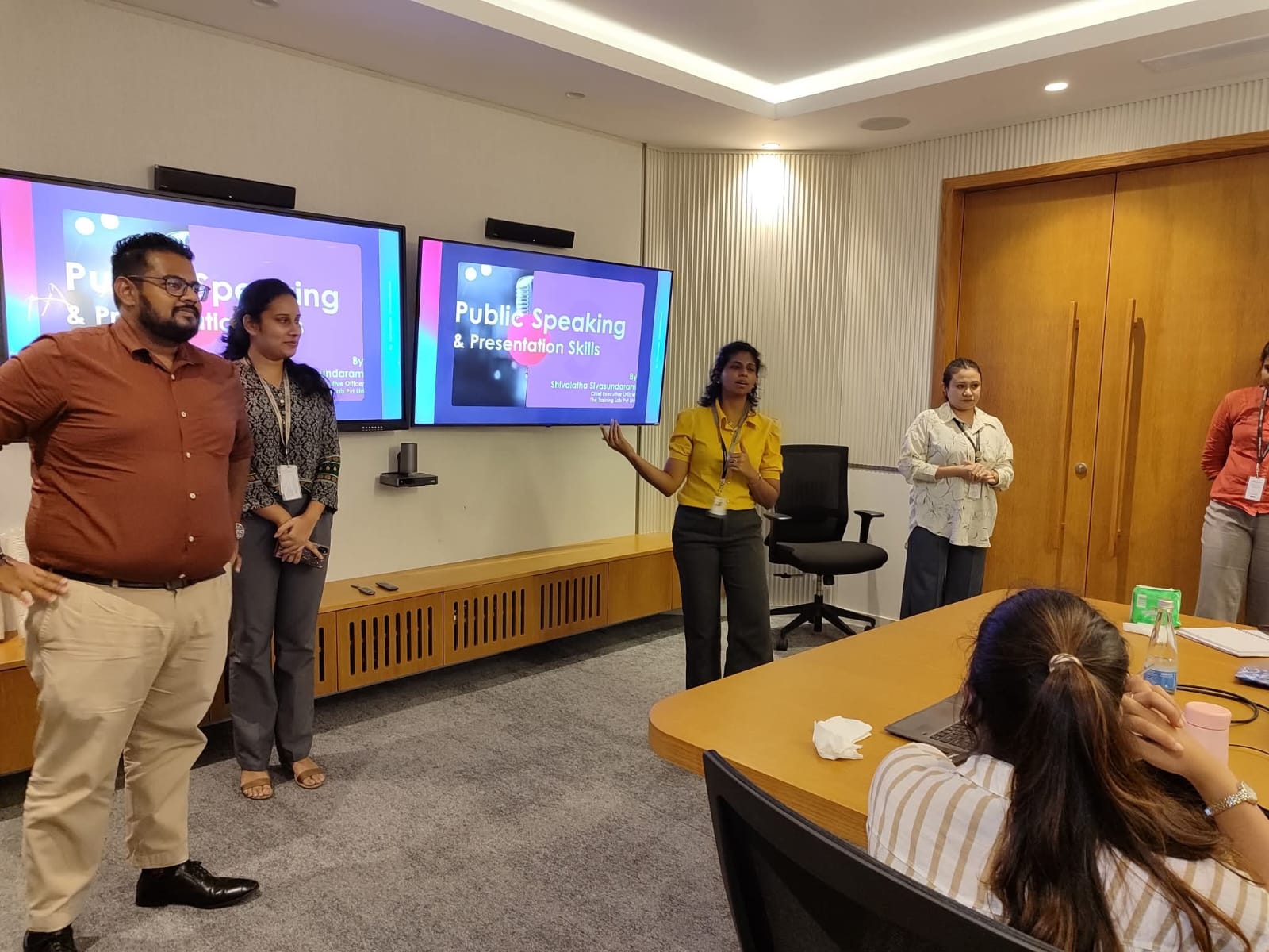 Participants practising public speaking and presentation skills